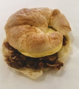 Avocado, Bacon, Egg & Cheese Croissant Sandwich Image