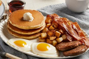 Eggs with Bacon or Sausage Image