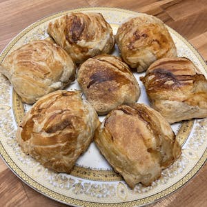 Traditional family bakery and small restaurant with tandoor, clay oven,  where samsa, traditional Uzbek pastry with ground lamb and onion, are baked  an - SuperStock