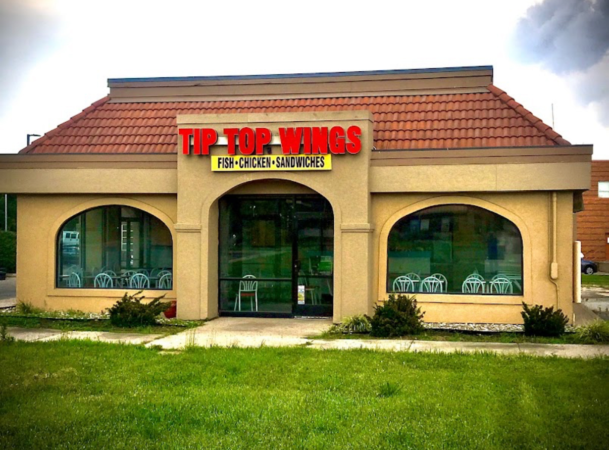 Tip Top Wings storefront exterior with red sign