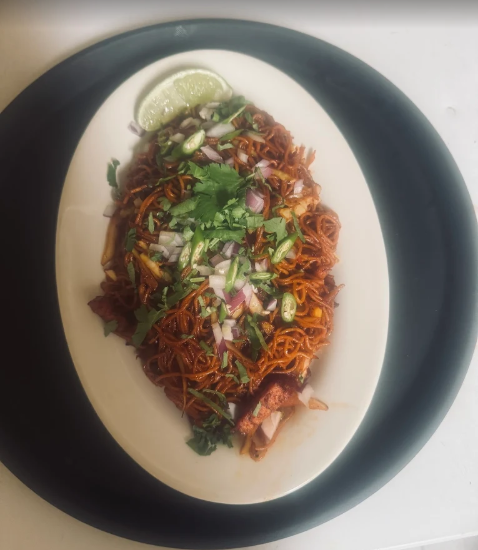 Indian-style thin stir-fried noodles tossed in a savory and spicy sauce