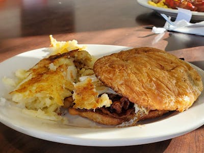 breakfast sandwich with eggs and hash browns